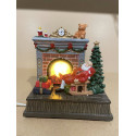Jule mand ved brændeovn med led lys der bevæger sig  H 15 cm L 15 cm D 10 cm